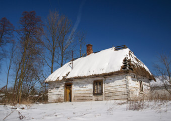 Traditional old wooden house in Poland in winter