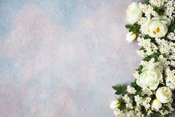 Wild rose and spirea flowers on a decorative background for text and congratulations