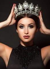 Photo of beautiful young girl in crown and black dress © Forewer
