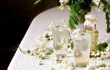 acacia flowers drink. lemonade with a syrup of white acacia flowers. Edible flowers.