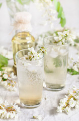 acacia flowers drink. lemonade with a syrup of white acacia flowers. Edible flowers.