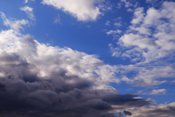 Blue sky with dark clouds