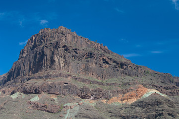 Cliff and Los Azulejos to the right. The Nublo Rural Park. Mogan. Gran Canaria. Canary Islands. Spain.