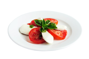 Caprese salad with mozzarella cheese, tomatoes and basil