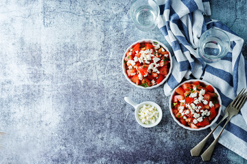 Obraz na płótnie Canvas Feta cheese tomato salad in a white bowl