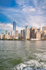Obraz premium View of New York City lower Manhattan skyline from the tourist ferry, Usa.