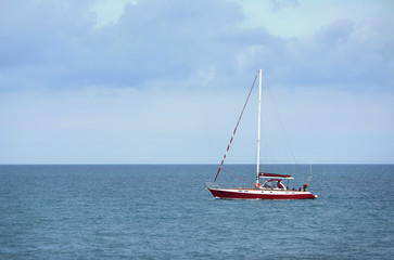 Small red and white yacht in the Black Sea