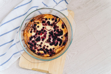 delicious curd casserole with berries, currants and cranberries. just out of the oven. simple recipe