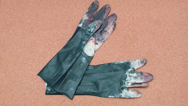 Safety Gloves being set over a cork surface