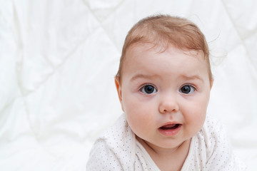 Cute baby with big eyes. Copy space