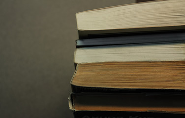 Different books in soft and hard cover. View from above.
