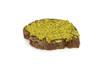 Fresh tasty home made bread with pesto, basil and parmesan on white background