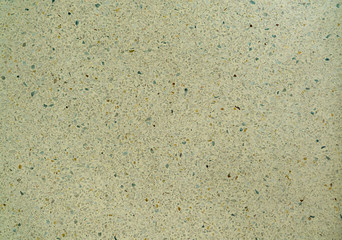 Concrete floor interspersed with granite chips.