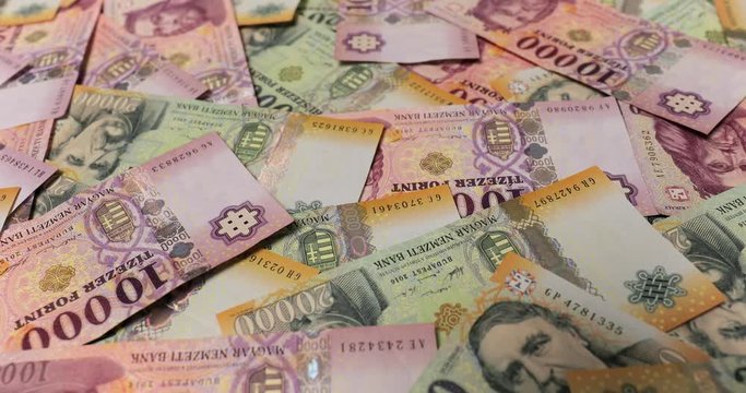 Pile of banknotes as a background (hungarian forint, 20000 10000), camera pushing in