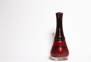 Red Nail polish bottle on white background
