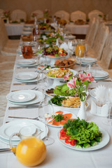set Banquet table with white dishes and flower