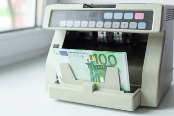 Euro currency on money counting machine. Automatic money counting in the machine