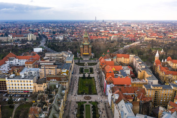 Fototapeta premium Beautiful cloudy sunset over Union Square - Piata Unirii Timisoara. Aerial view from Timisoara taken by a professional drone