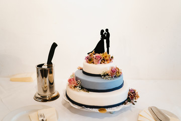 photo of a layered wedding cake with flowers