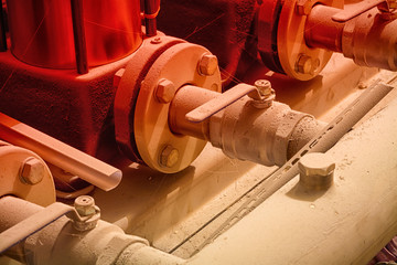 Water supply system of an apartment house. In the frame of a fragment of the pump and valves - the...