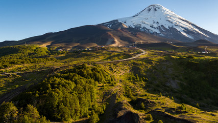 Path leading to the foot of the Osorno volcano, all green and snowless surroundings in summer season