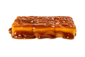 Tasty caramel candy isolated on white background.