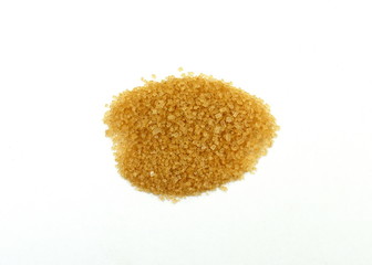 Closeup pile brown sugar isolated on white background.