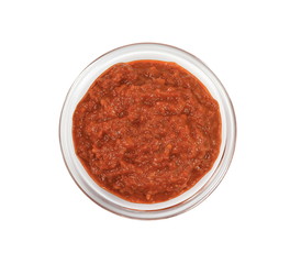 Bowl with red pesto isolated on white background. Bowl of traditional Italian red pesto isolated on white from above.