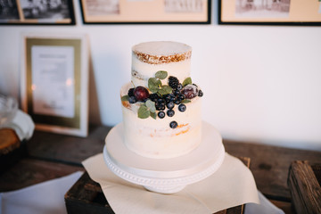 photo of a white cake with blueberry