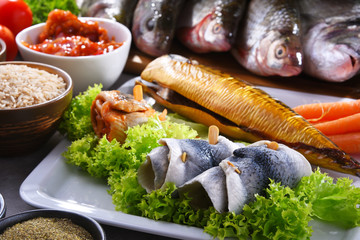Different sorts of fish on kitchen table