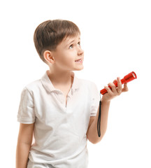 Little boy with flashlight on white background