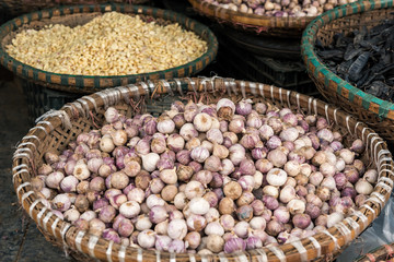 Baskets with garlic and onion on the traditional  street market, Hanoi, Vietnam.