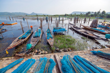 Fototapeta na wymiar fishing boats and fishing net at chilika lagoon