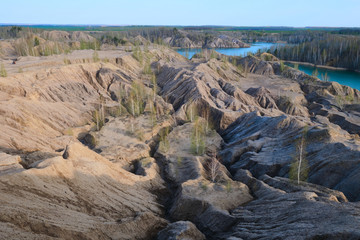 Fototapeta na wymiar Sandy quarry with blue water called Conduky or Romance Mountains