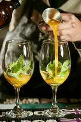 cocktail with kumquat on wooden background