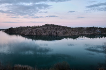Sandy quarry with blue water called Conduky or Romance Mountains