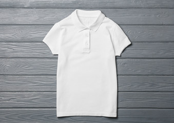 Stylish school uniform on wooden background