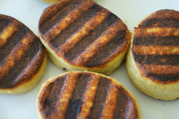 Small grilled cakes on the plate.