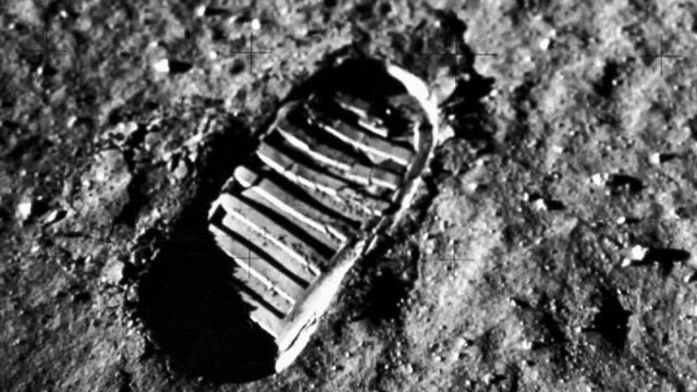 Closeup of a glitching footprint  on the moon from the moon landing voyage in outer space. Contains public domain image by NASA