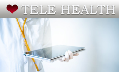 tele health concept doctor with tablet on a laptop screen