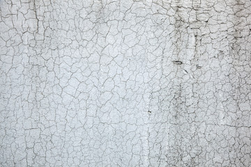 Texture of old paint. Aged cracked plaster on wall background