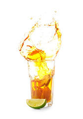 Glass of tasty cold ice tea with splash on white background