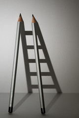 Ladder with a pencil for the efforts and tasks in the business.
