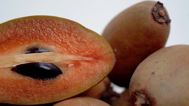 4k Close up, dolly shot of a pile of tropical fruit named Sapodilla
