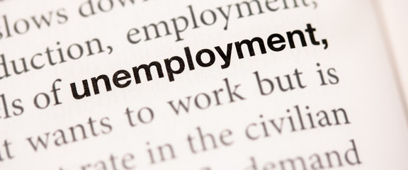 The word unemployment written in a book