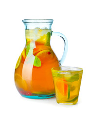 Jug of tasty cold tea on white background