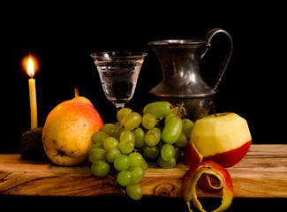 A still life with fruits, an apple, a peach and grapes, a jar of tin and a glass of water in style of an ancient artist