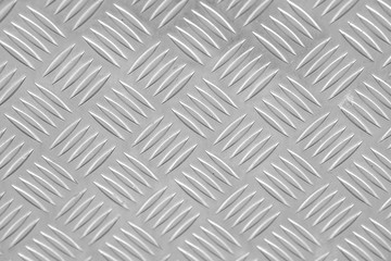 Metal floor plate with diamond pattern.