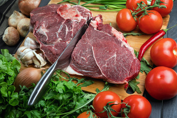 A juicy piece of fresh meat. Meat and vegetables. Cooking meat. A chef's knife. Balanced diet. Red meat.