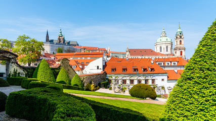 Prague Castle and St Nicholas Church in Lesser Town of Prague. Sunny spring day view from Vrtba...